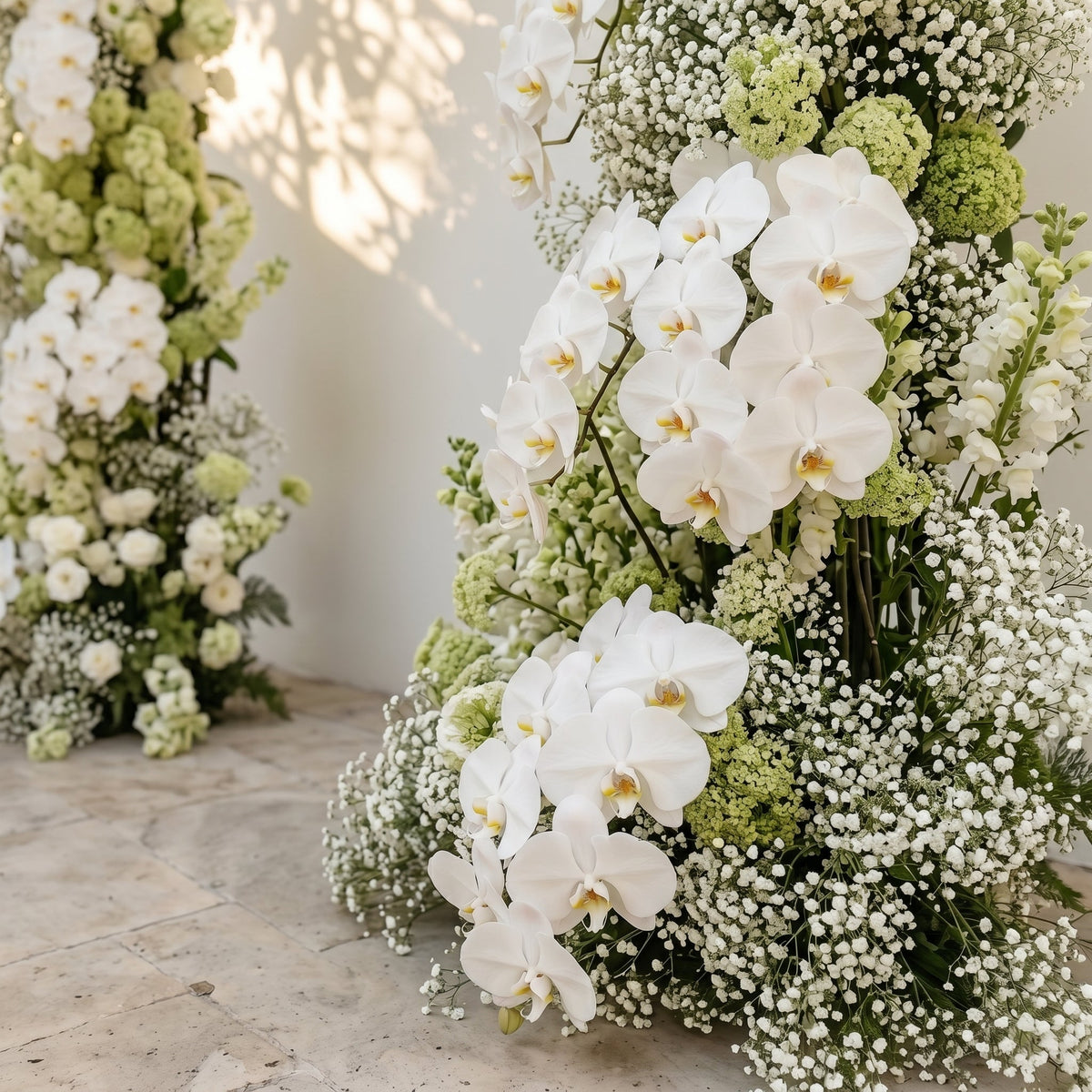 Maellyra:Ivory White Orchid & Fresh Green Silk Floral Ground Horn Arch Arrangement with Soft Sorelia & Cascading Lush Greenery for Romantic Minimalist Weddings & Garden Event Decor Frame Included