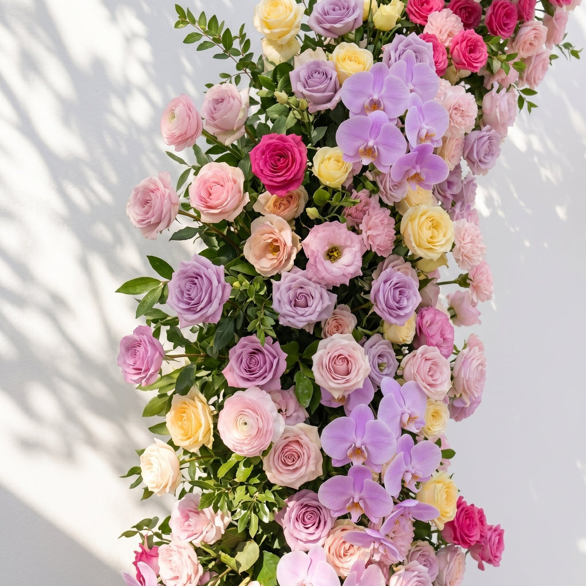 Maressa: Luxury Pastel Rainbow, Lilac Purple & Blush Pink Silk Floral Ground Horn Arch Arrangement with Soft Sorelia & Cascading Greenery for Romantic Minimalist Weddings & Garden Event Decor Frame Included